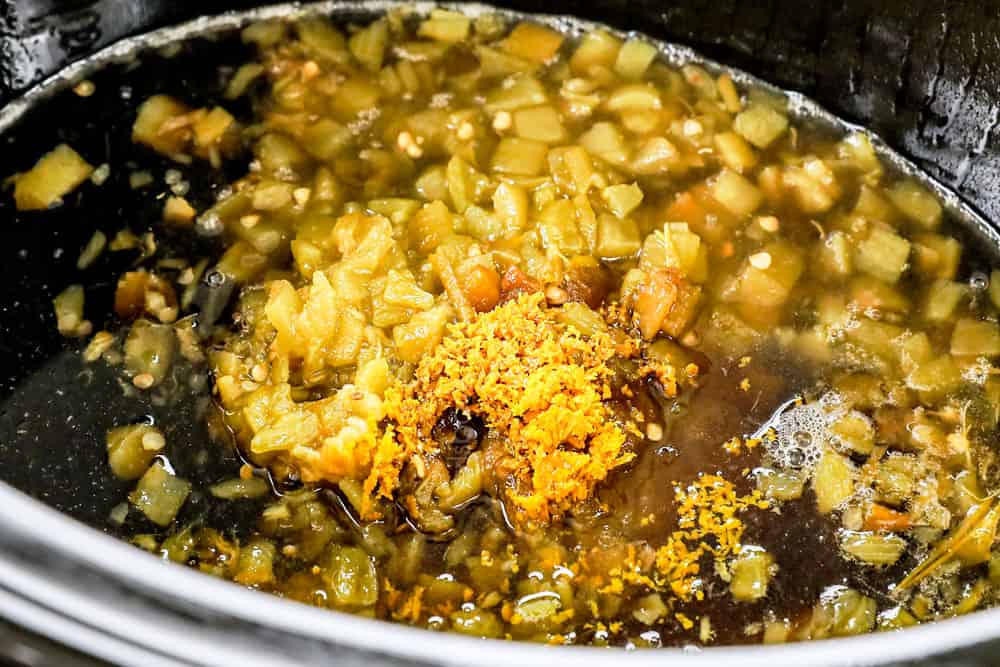showing how to make pulled pork sandwiches by adding braising liquid to the slow cooker