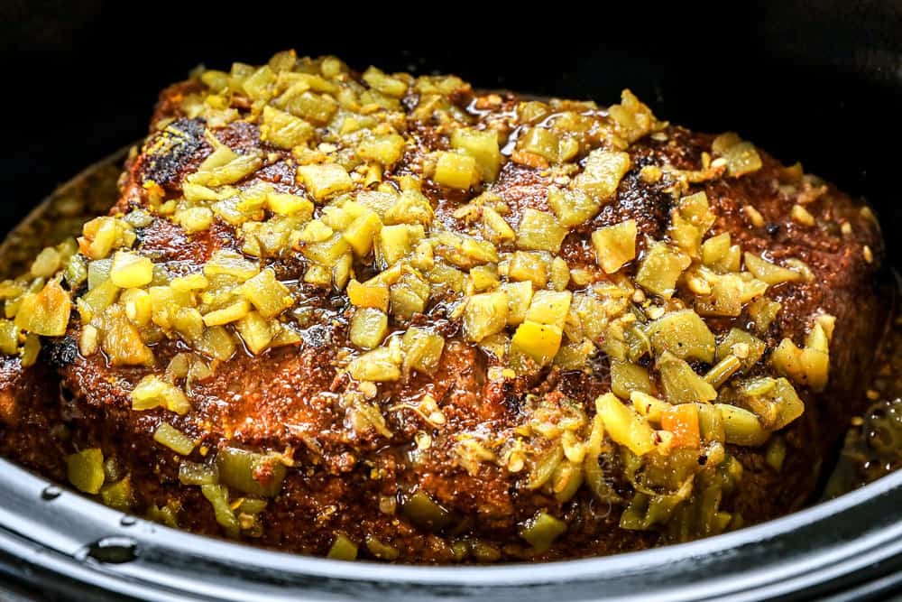 showing how to make BBQ pulled pork sandwiches by cooking pork in a slow cooker until tender