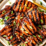 top view of grilled chicken thighs on a platter