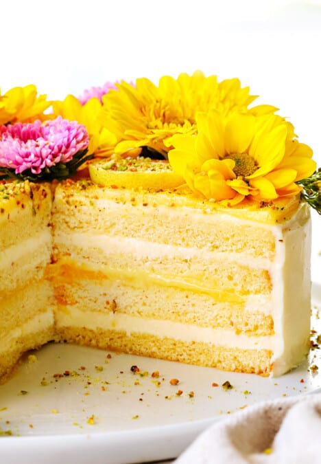 layer cake sliced open showing the layers of frosting, cake and lemon curd