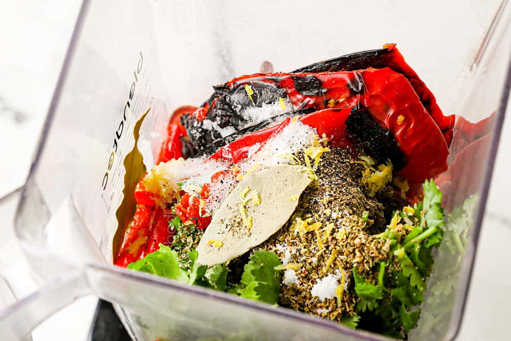 showing how to make peri peri chicken by making peri peri sauce by adding bird's eye chili peppers, bell peppers, lemon juice, red wine vinegar, lemon zest, cilantro, oregano to the blender