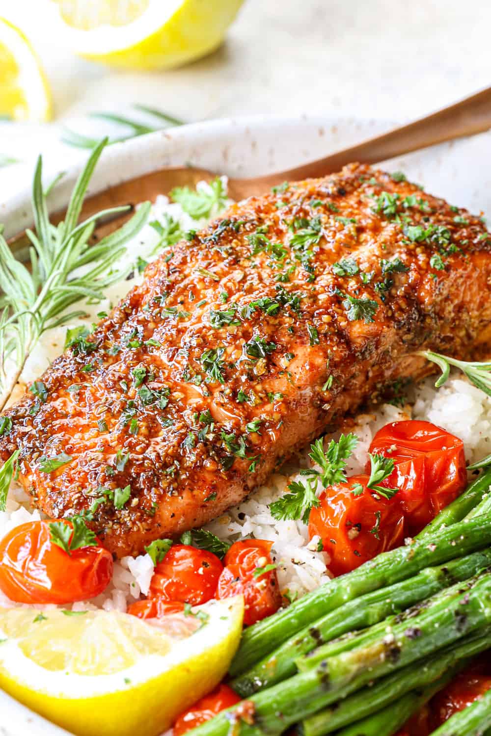 side view showing how to serve cedar planked salmon in a bowl with rice and vegetables garnished with parsley