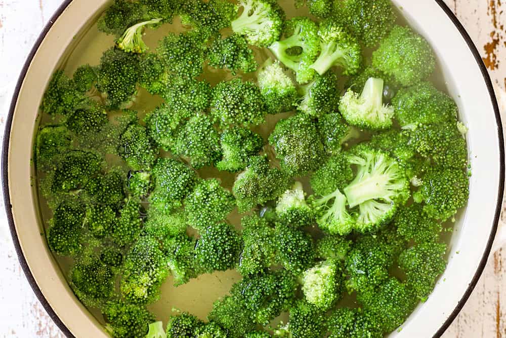 showing how to make Chicken Broccoli Alfredo recipe by cooking broccoli in pasta water