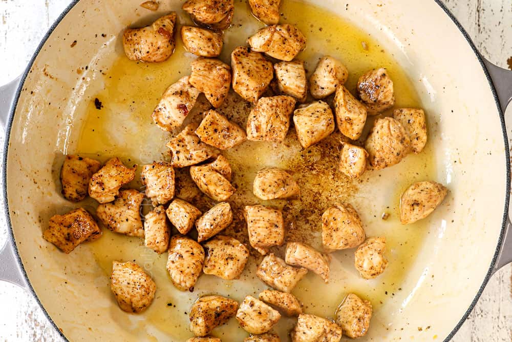 showing how to make Chicken Broccoli Alfredo recipe by sautรฉing chicken in a pan