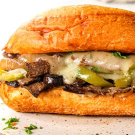 up close of Crockpot Philly Cheesesteak recipe showing how juicy the beef is