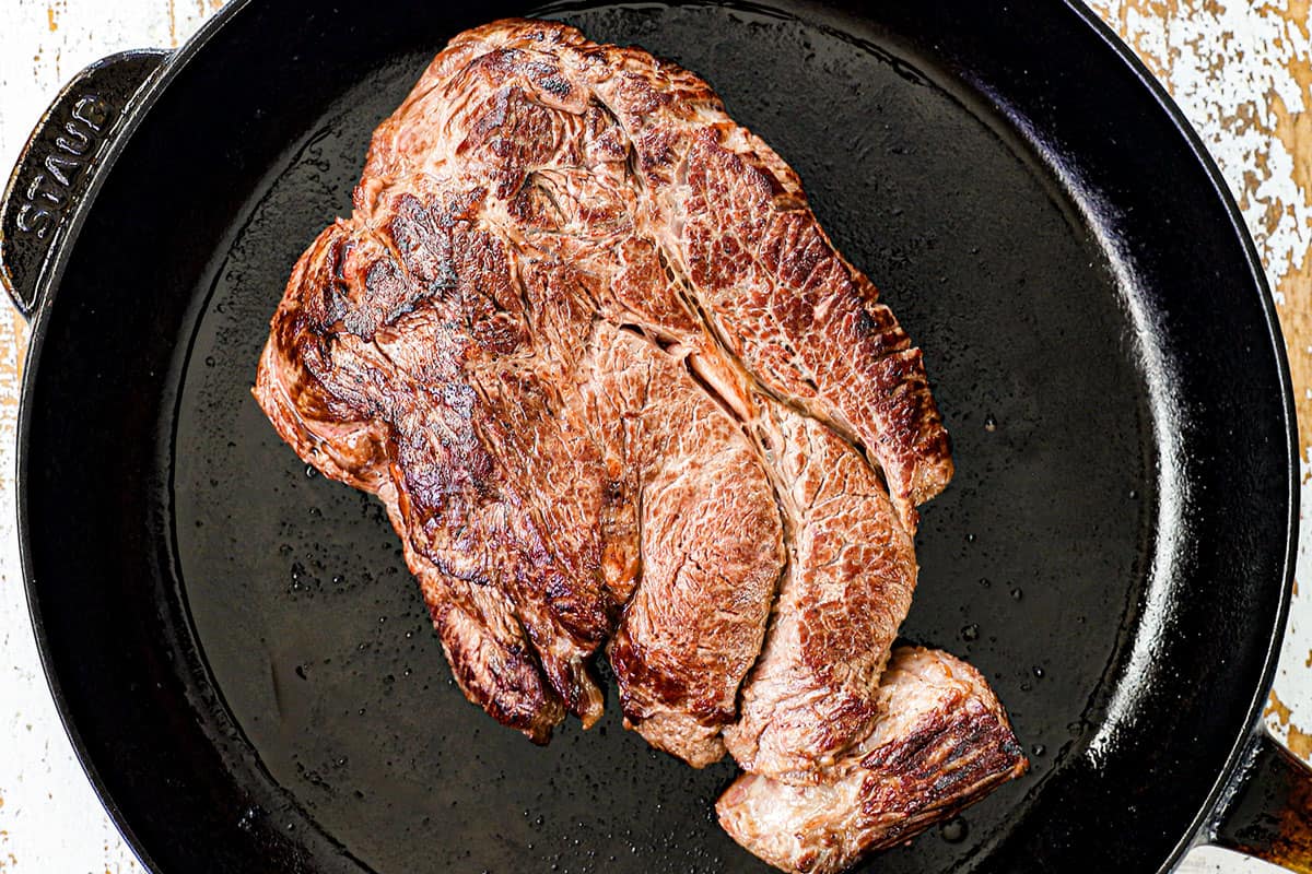 top view showing how to make crockpot Philly cheesesteak by searing the roast until deeply golden