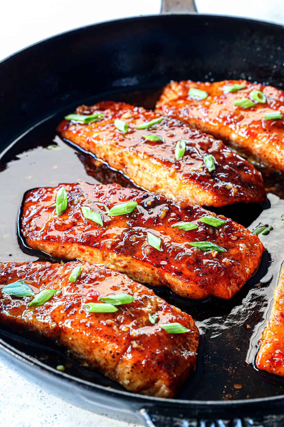Firecracker salmon fillets pan seared in a cast iron skillet