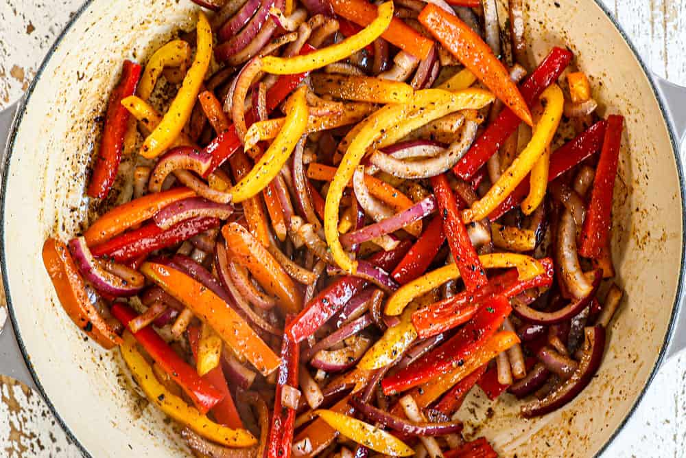 showing how to make jerk chicken pasta (Rasta pasta) by sautรฉing bell peppers, onions and garlic