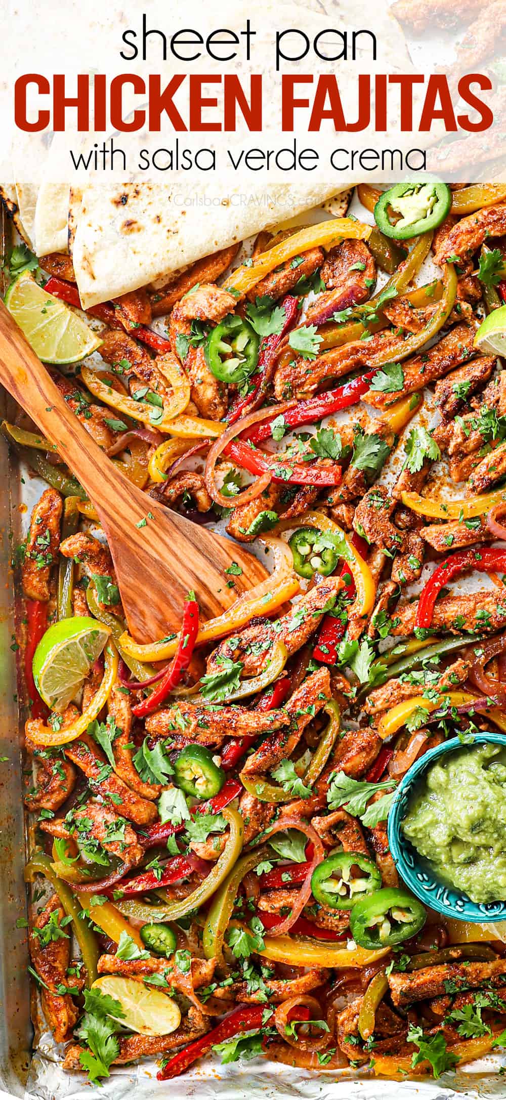 top view showing how to make sheet pan chicken fajitas by tossing chicken and bell peppers together on a baking sheet
