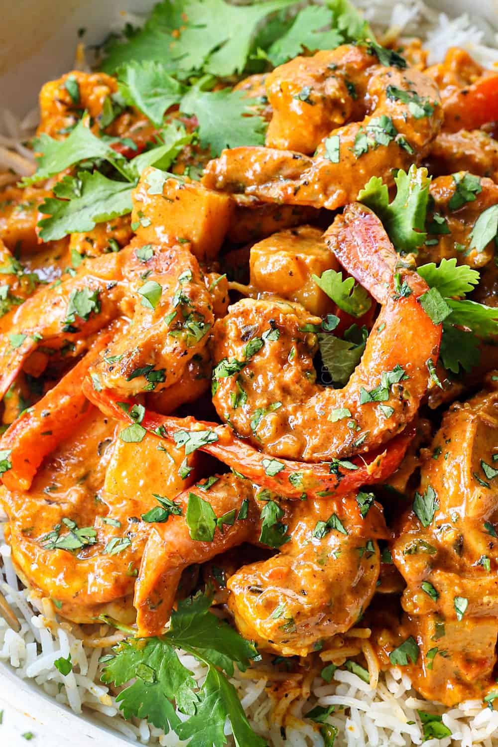 up close of curry shrimp showing how juicy the shrimp is
