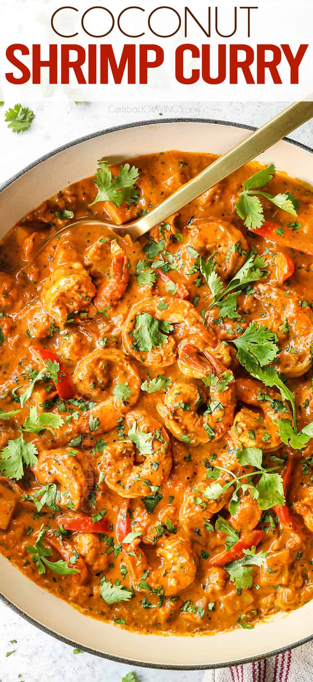 top view of cooking curry shrimp in a pan garnished with cilantro