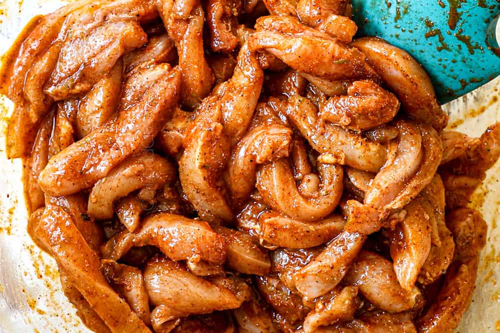 showing how to make sheet pan chicken fajitas by marinating chicken strips in lime juice, orange juice and fajita seasoning