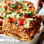 up close of a serving a slice of taco lasagna showing all the layers