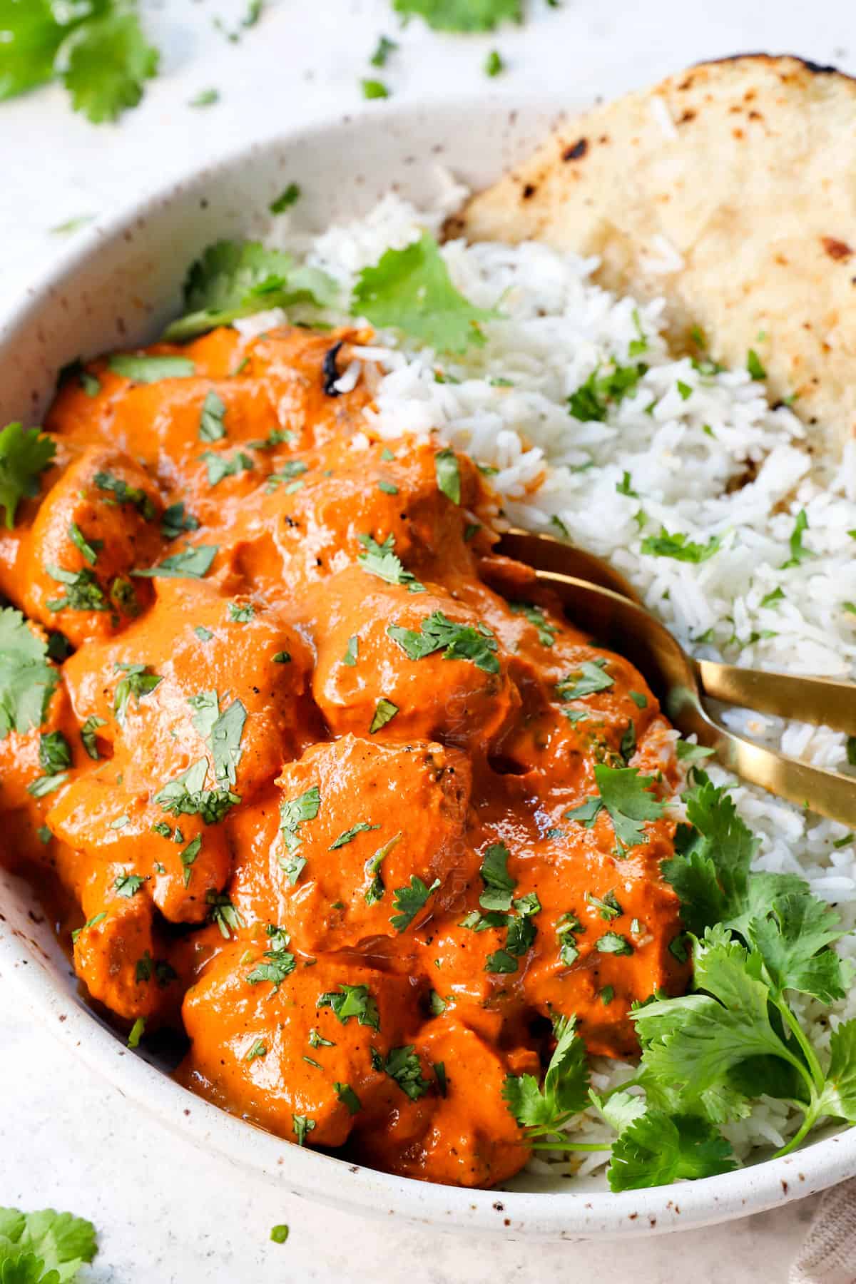 up close or tikka masala with chicken in a bowl with rice