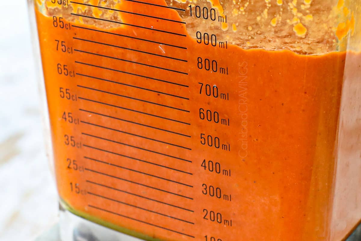 showing how to make Chicken Tikka Masala recipe by blending the masala curry sauce in a blender until smooth