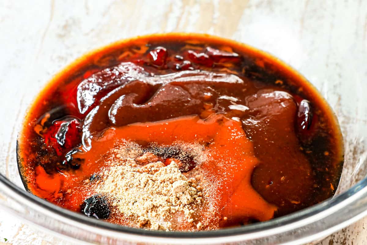 showing how to make grape jelly meatball recipe in the crockpot by whisking together the grape jelly chili sauce ingredients