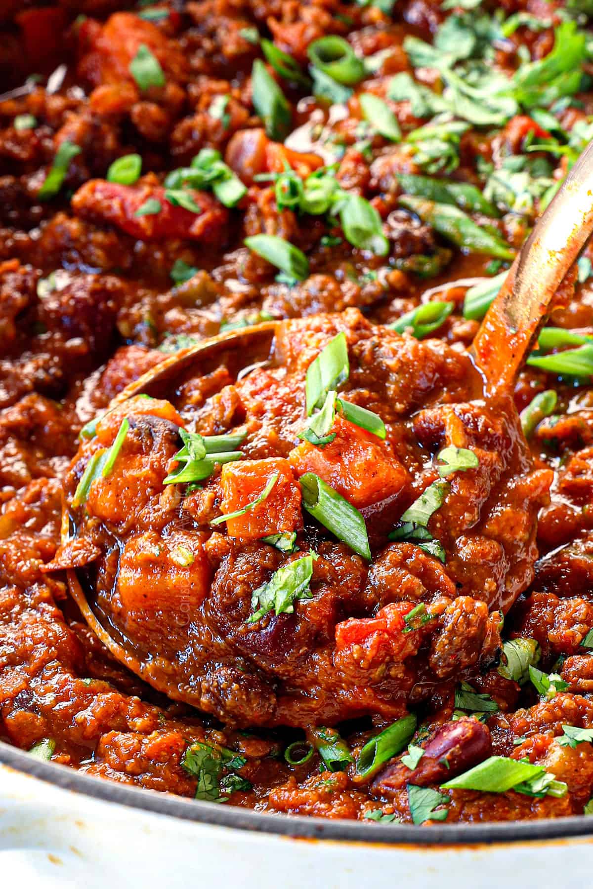 up close of scooping up pumpkin chili recipe showing how thick and hearty it is