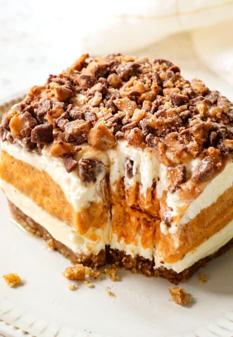 a slice of pumpkin delight (pumpkin lush) with a bite taken out