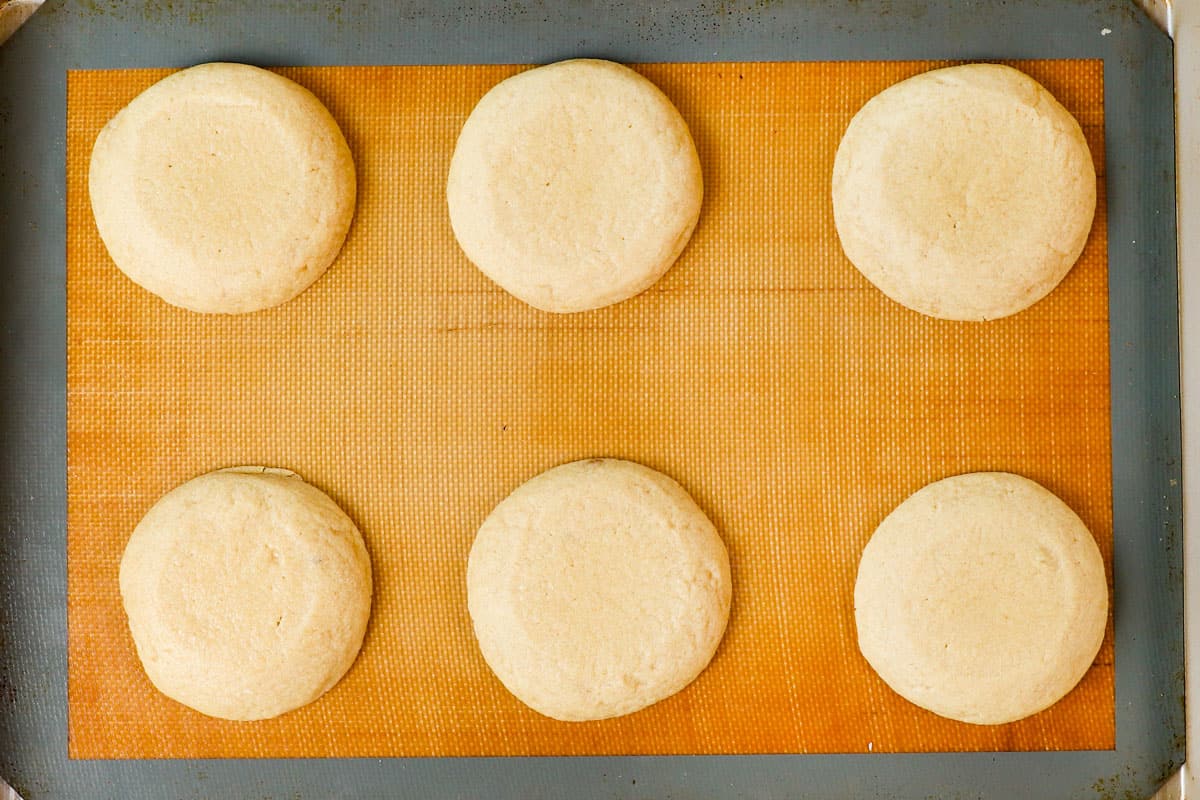 showing how to make pecan pie cookies by baking the cookies in the oven until set