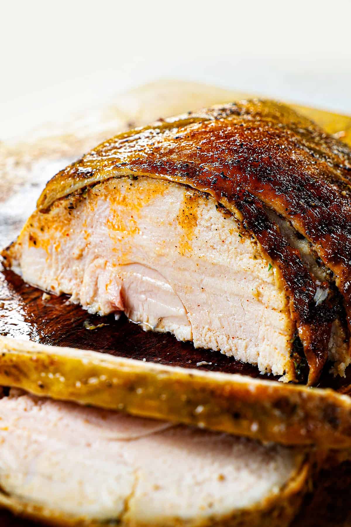 showing how to slice the roast turkey breast recipe on a cutting board