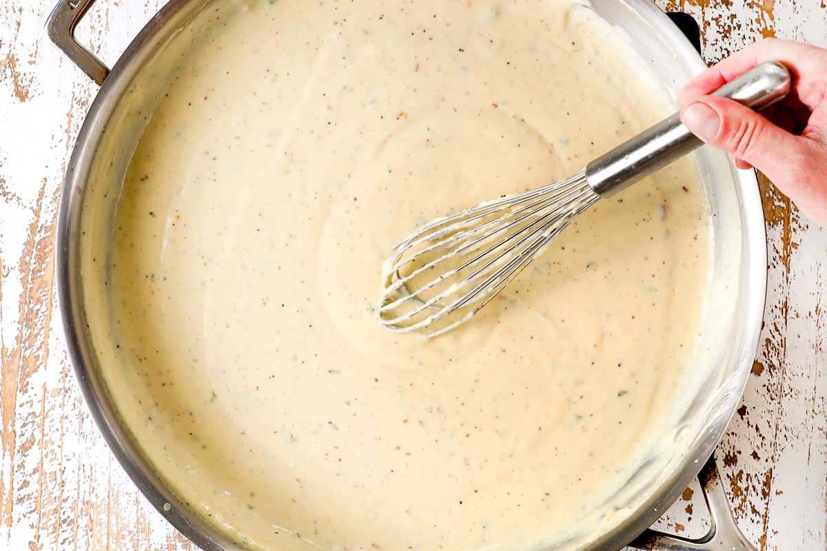 showing how to make old fashioned baked macaroni by simmering the bรฉchamel sauce until thick