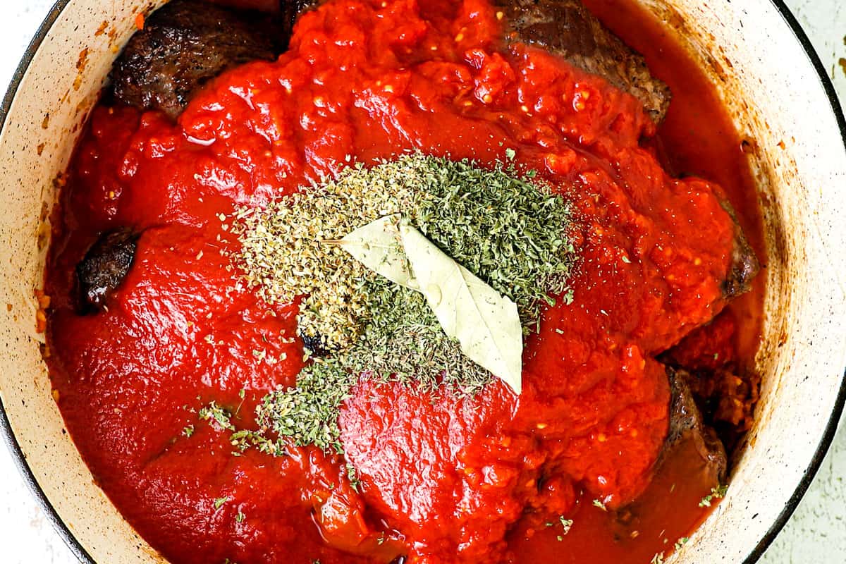 showing how to make beef ragu by making ragu sauce with braised beef, crushed tomatoes, tomato sauce, onions, garlic, basil and sofrito