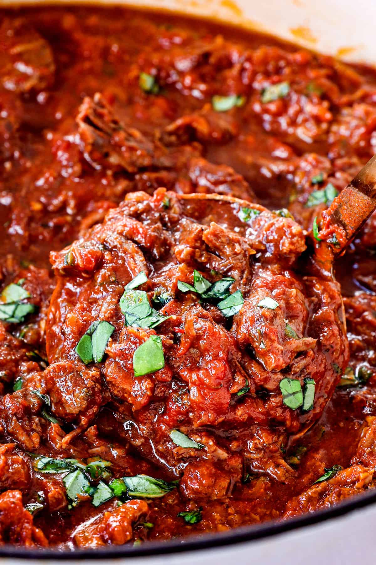 showing how to make ragu sauce with shredded beef