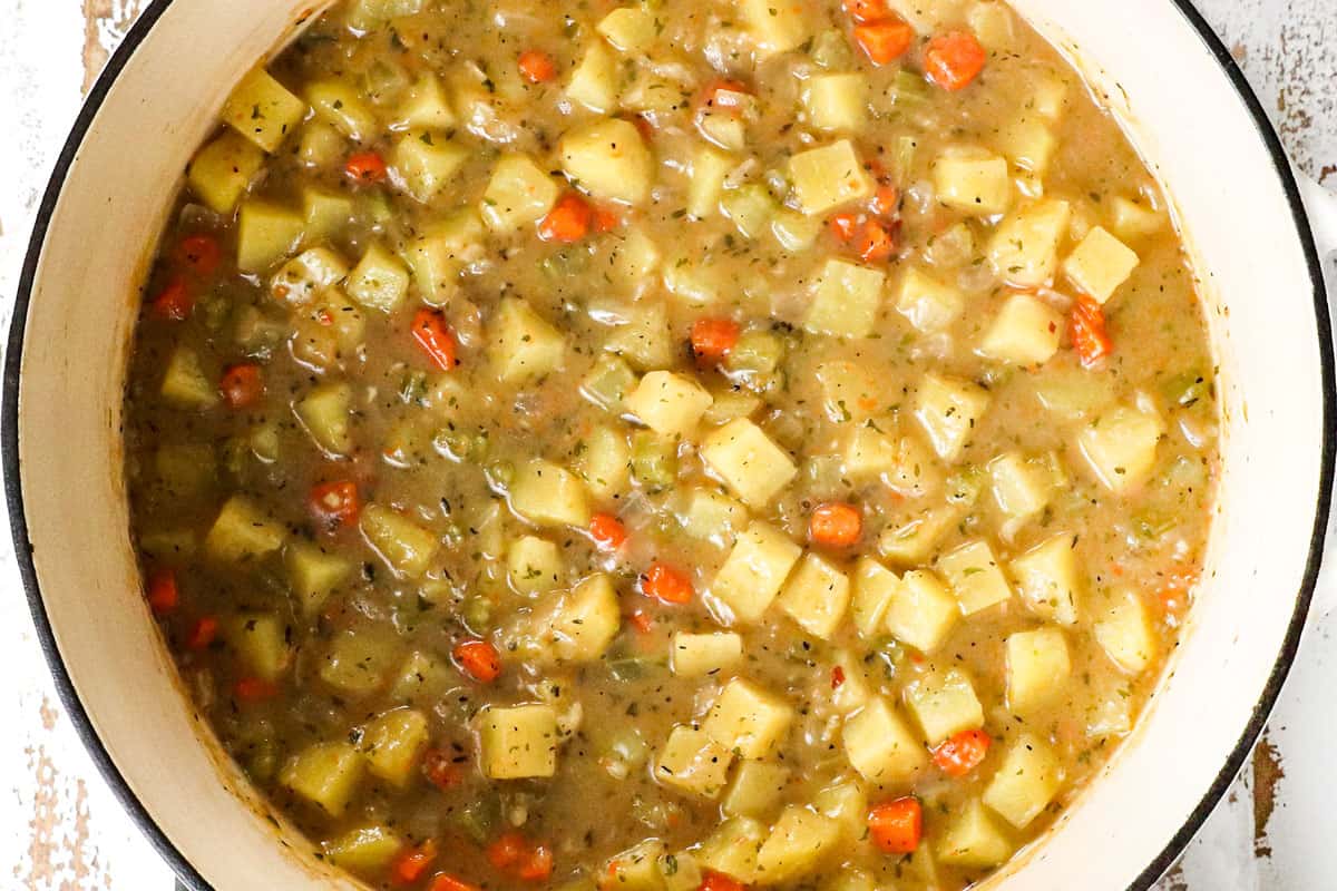 showing how to make Ham and Potato Soup by simmering the soup until thickened