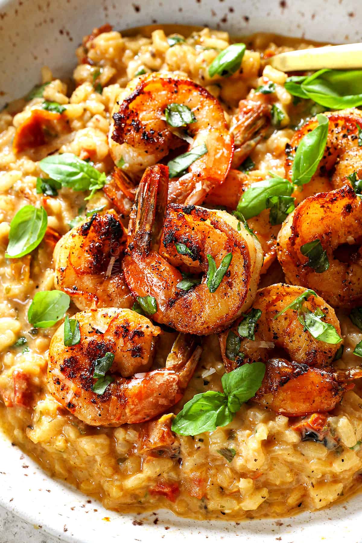 serving Italian shrimp risotto with creamy risotto and sautรฉed shrimp