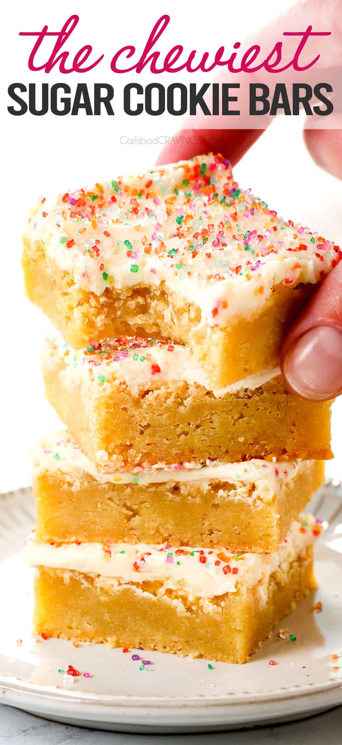 picking up sugar cookie bars showing how thick, soft and chewy they are