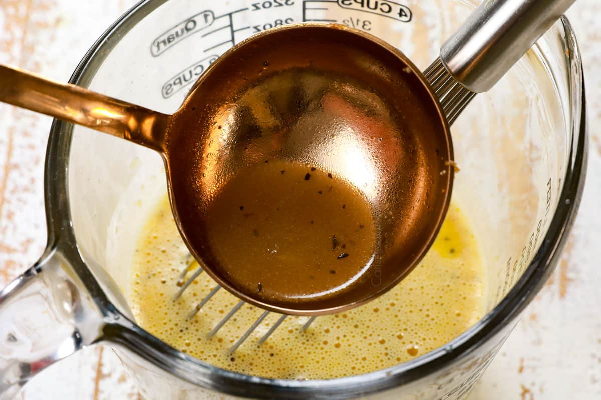 showing how to make traditional Avgolemono Soup recipe (Greek Lemon Chicken Soup) by tempering the eggs by whisking broth into the eggs and lemon juice