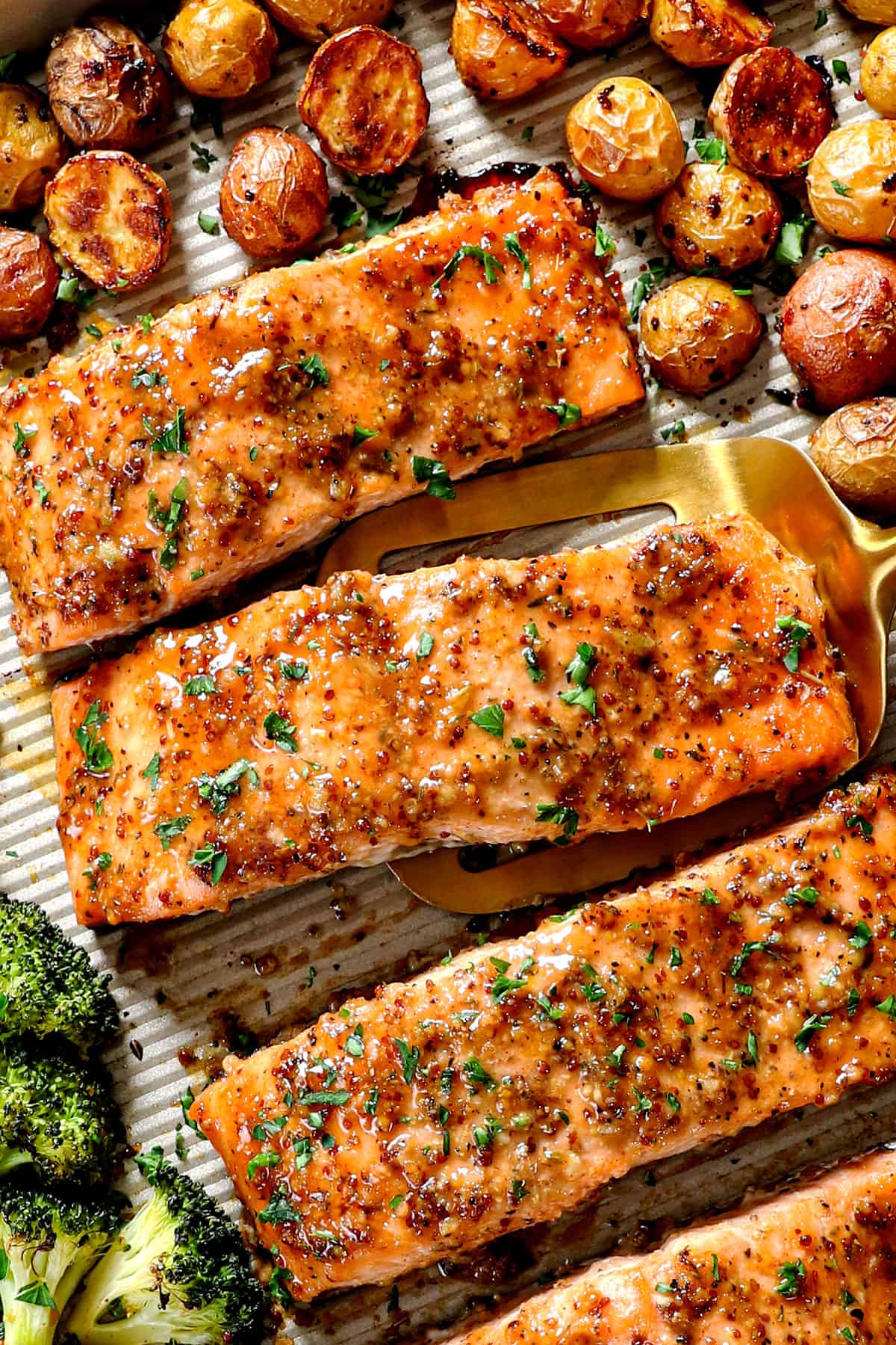 up closer of baked honey mustard salmon showing how juicy it is