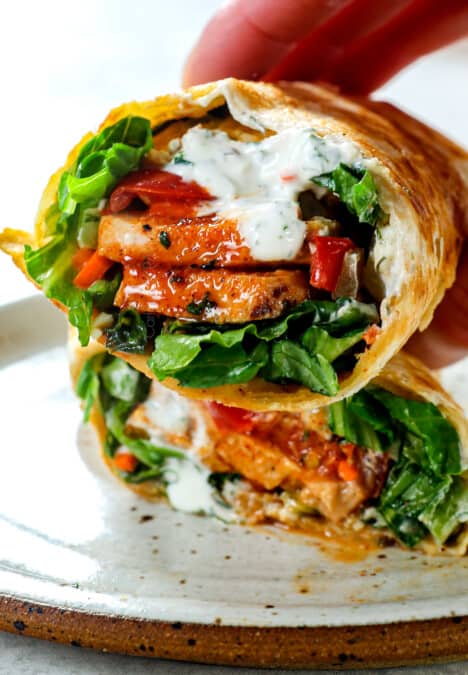 picking up buffalo chicken wraps showing the filling ingredients