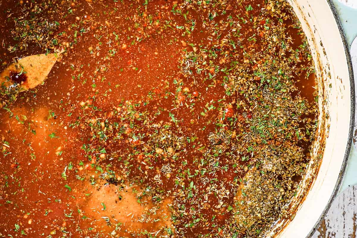 showing how to make gumbo recipe by simmering the chicken until tender