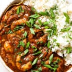 showing how to serve chicken and sausage gumbo in a bowl with rice
