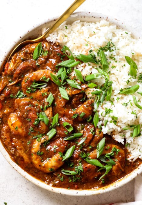 showing how to serve chicken and sausage gumbo in a bowl with rice