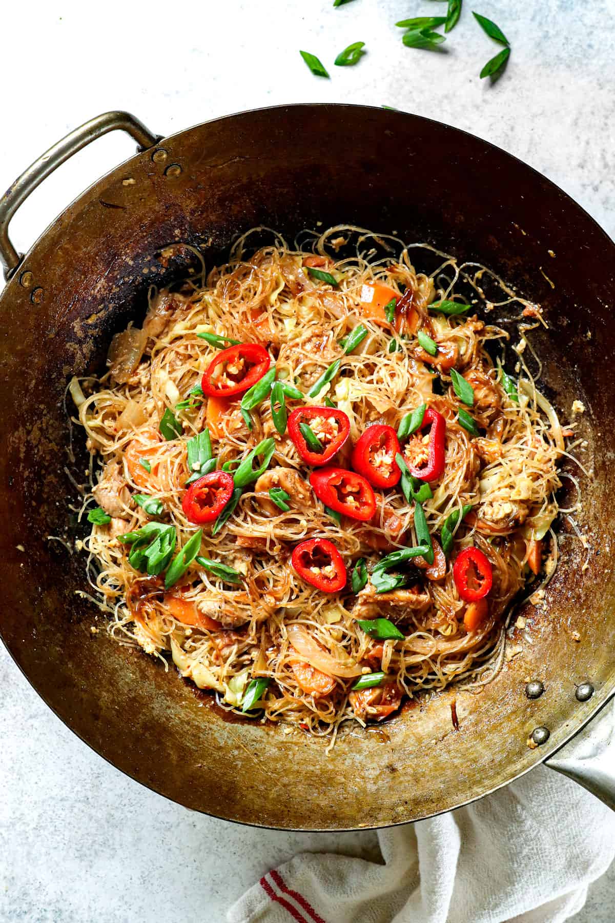 top view of pad woon sen in a wok with pad woon sen sauce