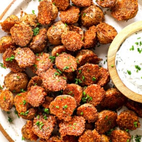 top view of serving crispy Parmesan Crusted potatoes with herb sauce