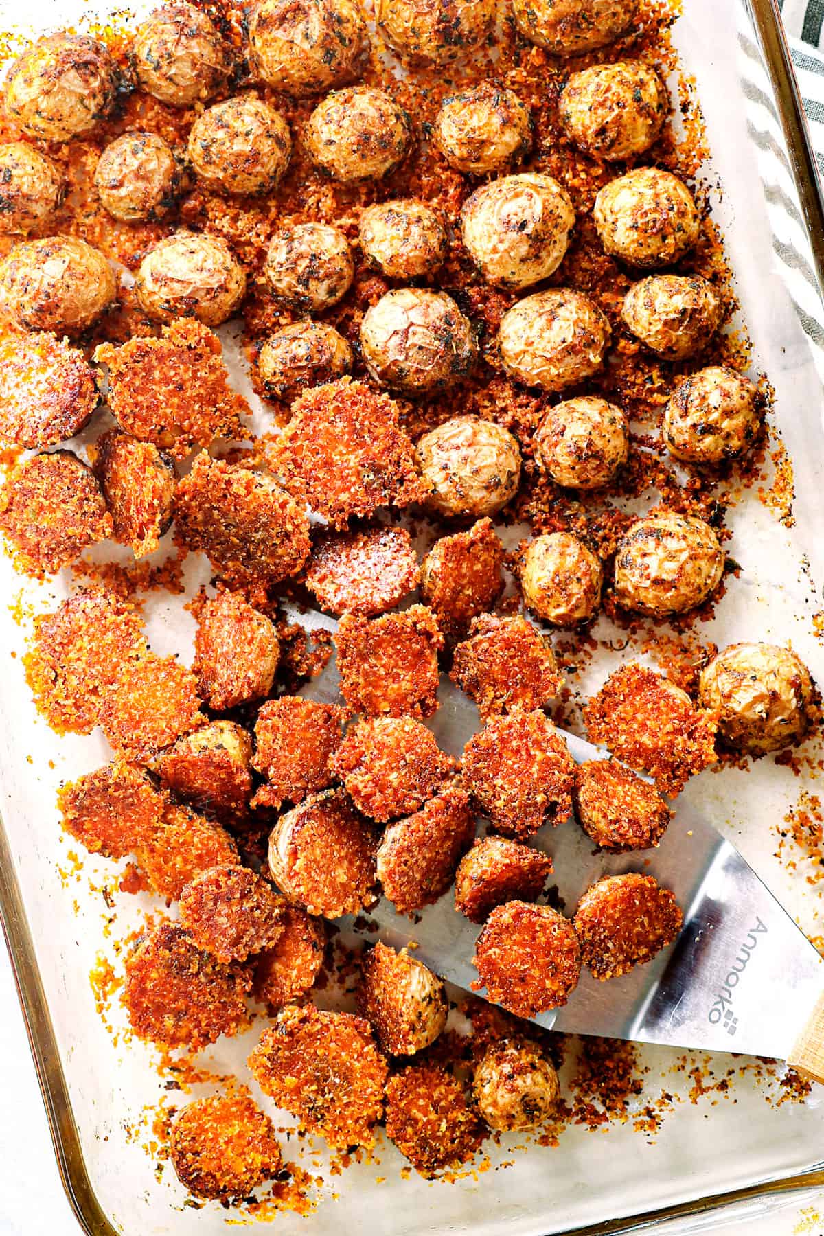 crispy oven roasted Parmesan crusted potatoes in a baking pan