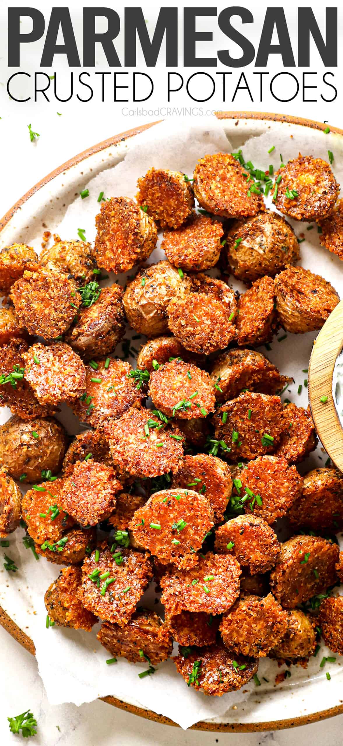 top view of serving crispy Parmesan Crusted potatoes with herb sauce