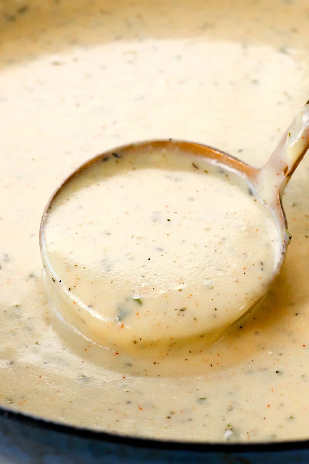 showing how to make chicken fried steak by simmering gravy until smooth