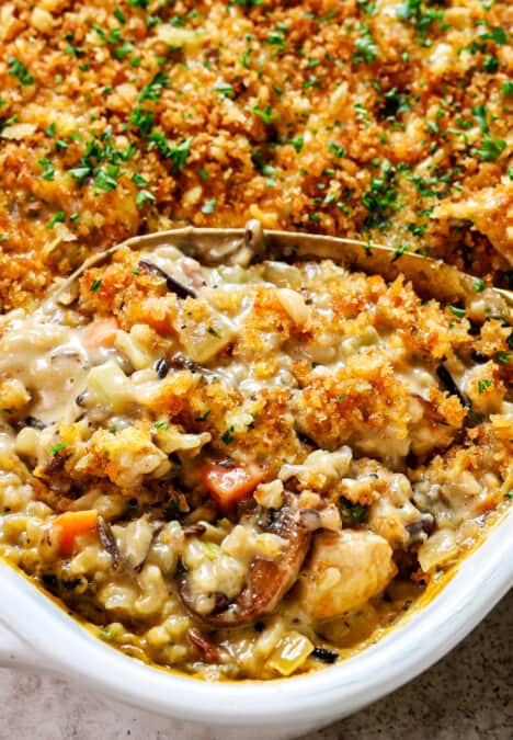 up close of serving chicken wild rice casserole showing how creamy it is