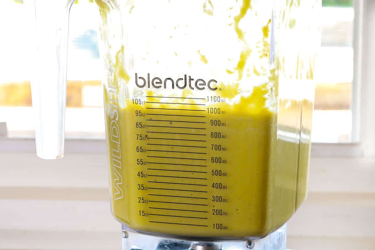 showing how to make Asparagus Soup recipe by blending it in a blender to make it creamy