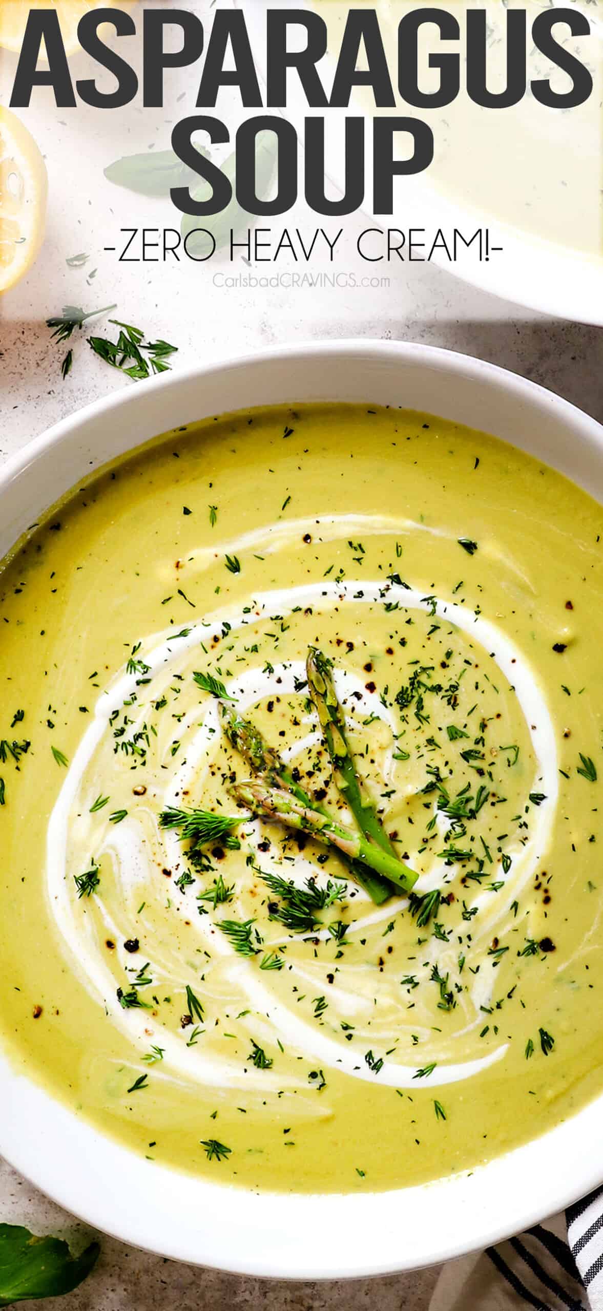 top view of Creamy Asparagus Soup in bowls garnished by asparagus spears and fresh dill