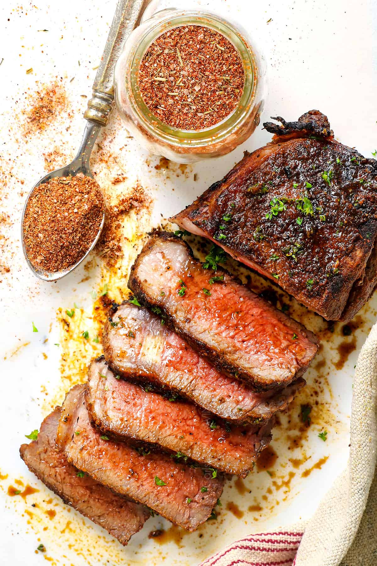 showing how to use steak seasoning by cooking steak with the steak rub