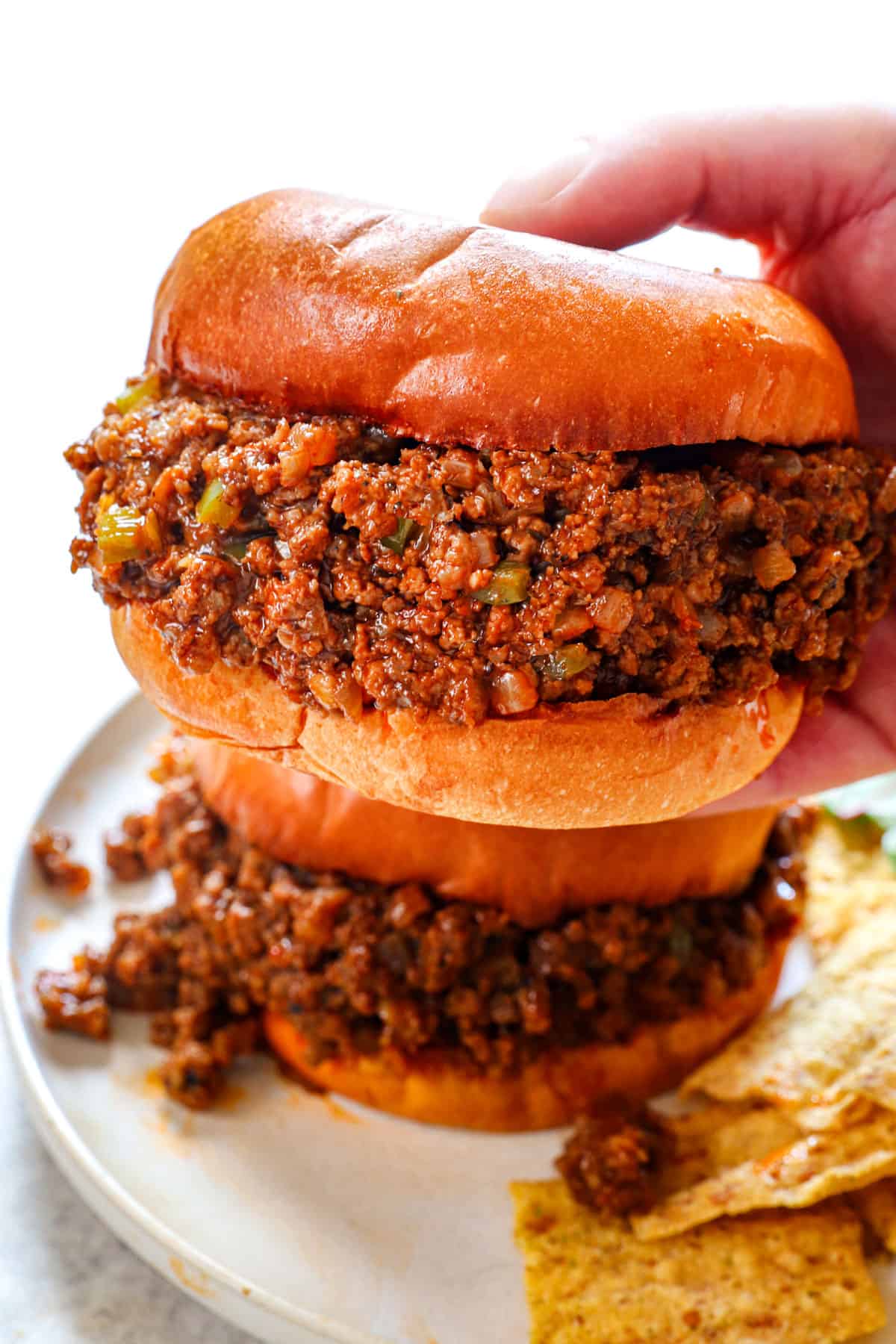 showing how to serve best sloppy Joe recipe with chips and salad