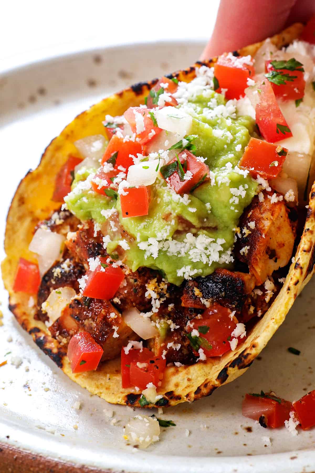 up close of picking up chicken street taco recipe