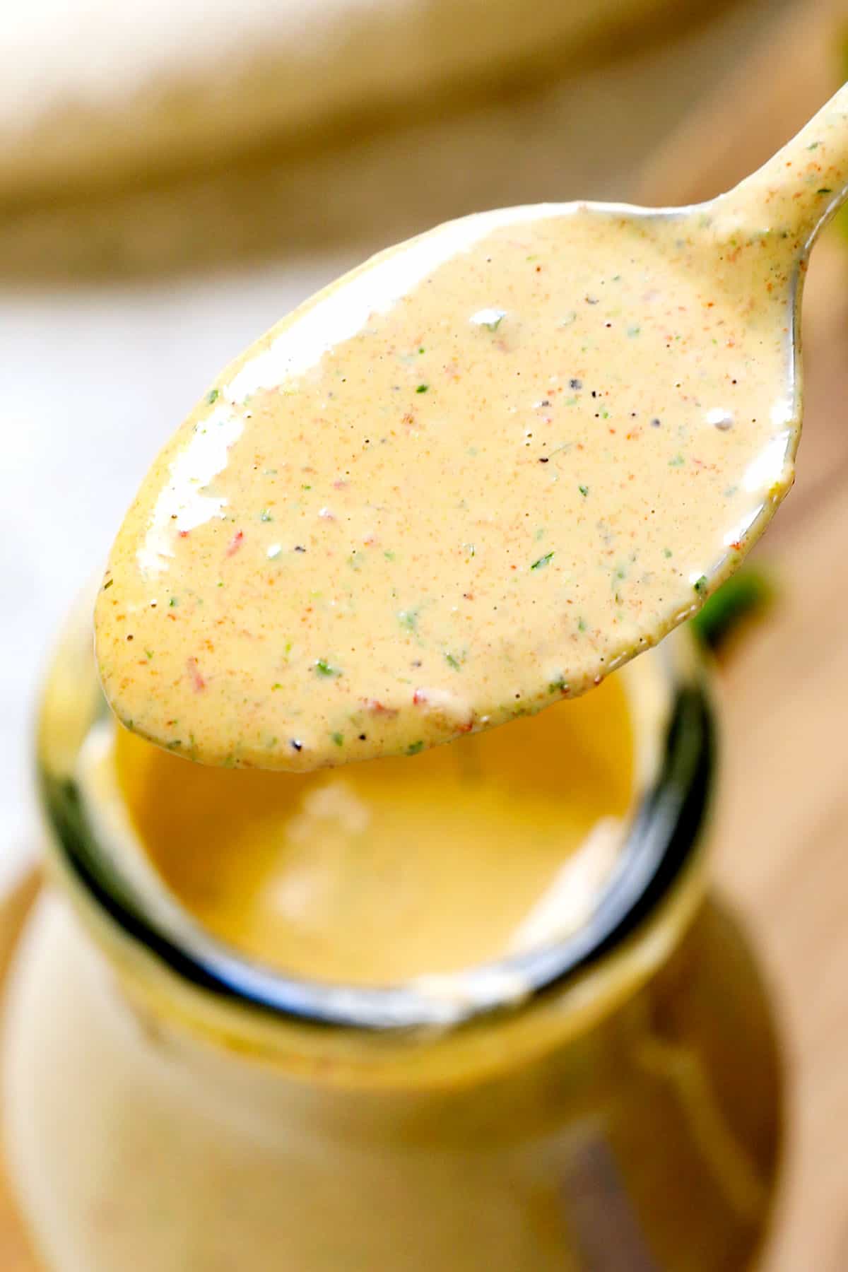 up close of a spoonful of chipotle dressing recipe showing the blended ingredients