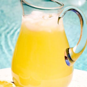 serving lemonade in a pitcher by the pool