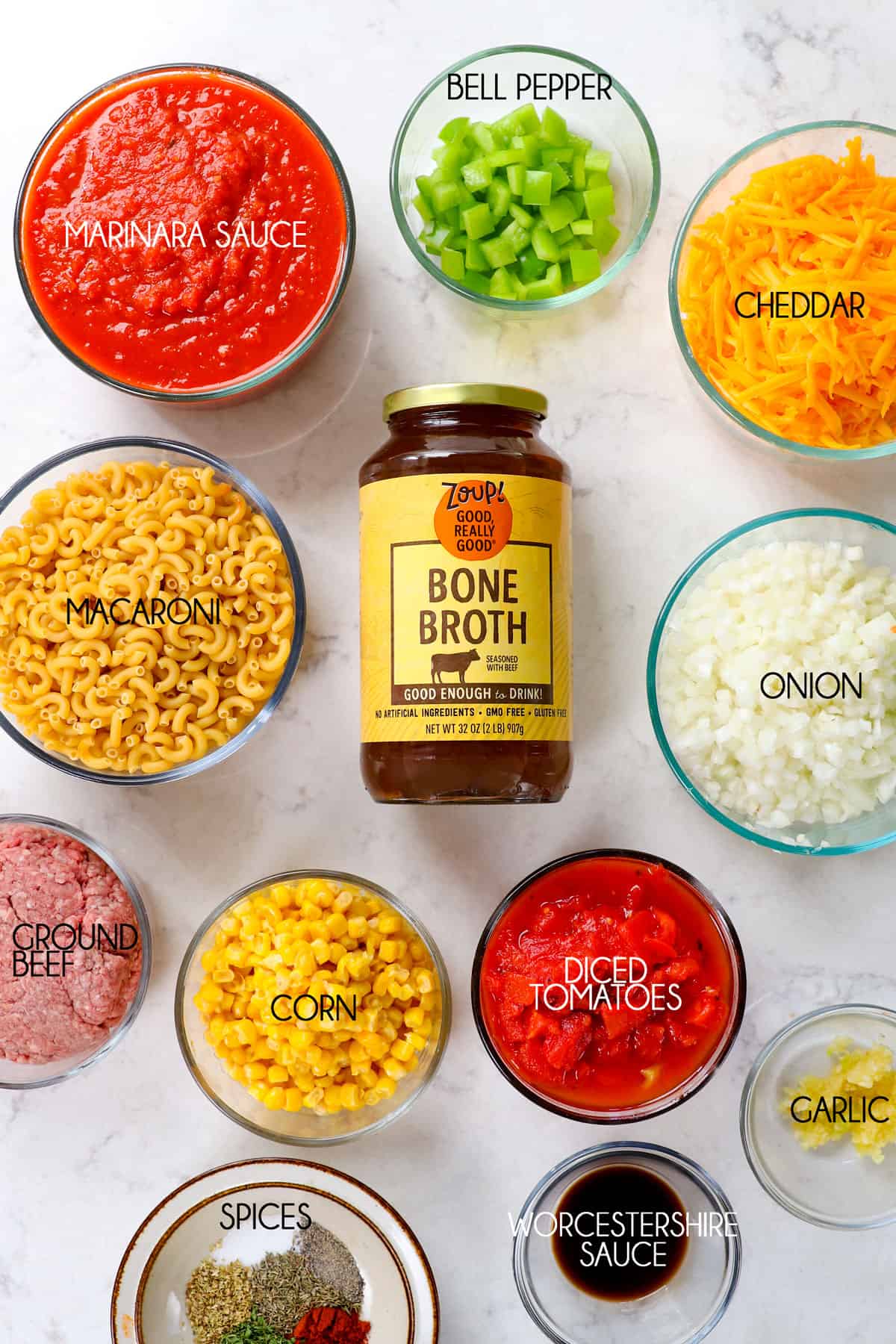 showing how to make goulash (American Chop Suey) by lining the ingredients on the counter